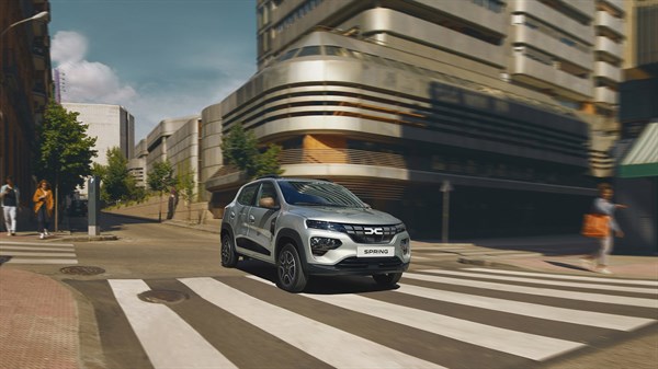 a dacia spring diving. a view from the front right side of the car