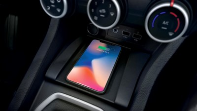 a phone is charging with the wireless charger of the renault clio