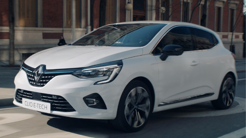 a white renault clio on the road driving