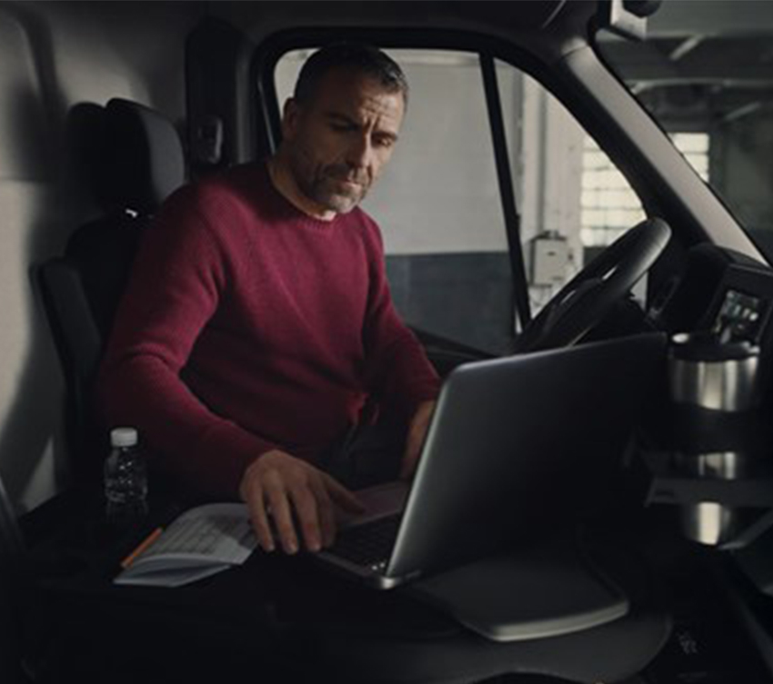 a man sitting in driver's seat of renault new master